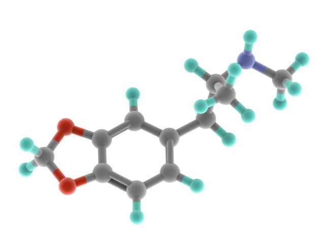 MDMA drug, molecular model. Atoms are represented as spheres and are colour-coded: carbon (grey), hydrogen (blue-green), oxygen (red) and nitrogen (blue).